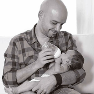 Father feeding baby