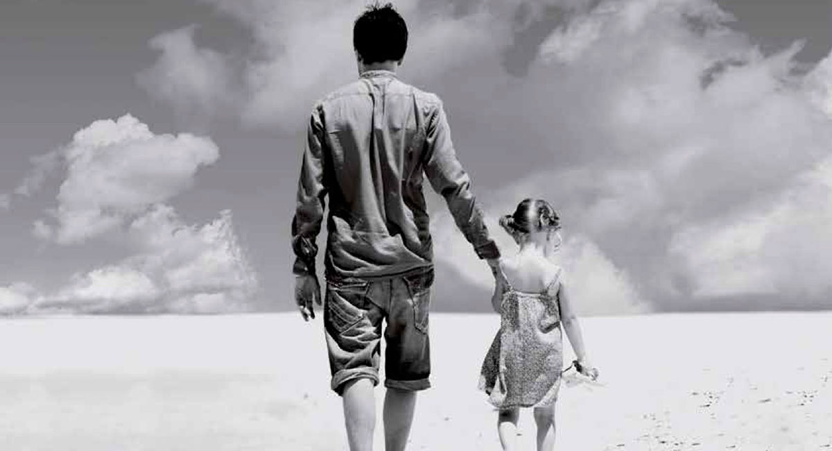 Dad and daughter holding hands