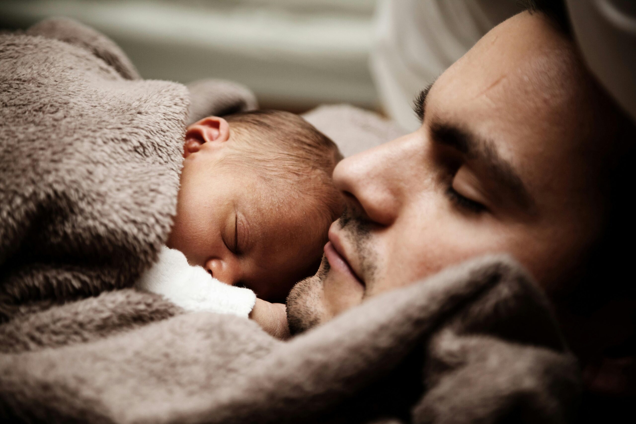 sleeping baby and father